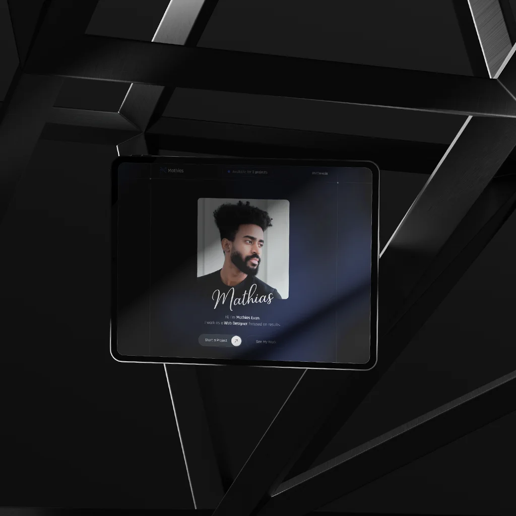 Tablet mockup displaying a dark-themed personal portfolio webpage with a portrait and the name Mathias on screen, set against a black geometric background.